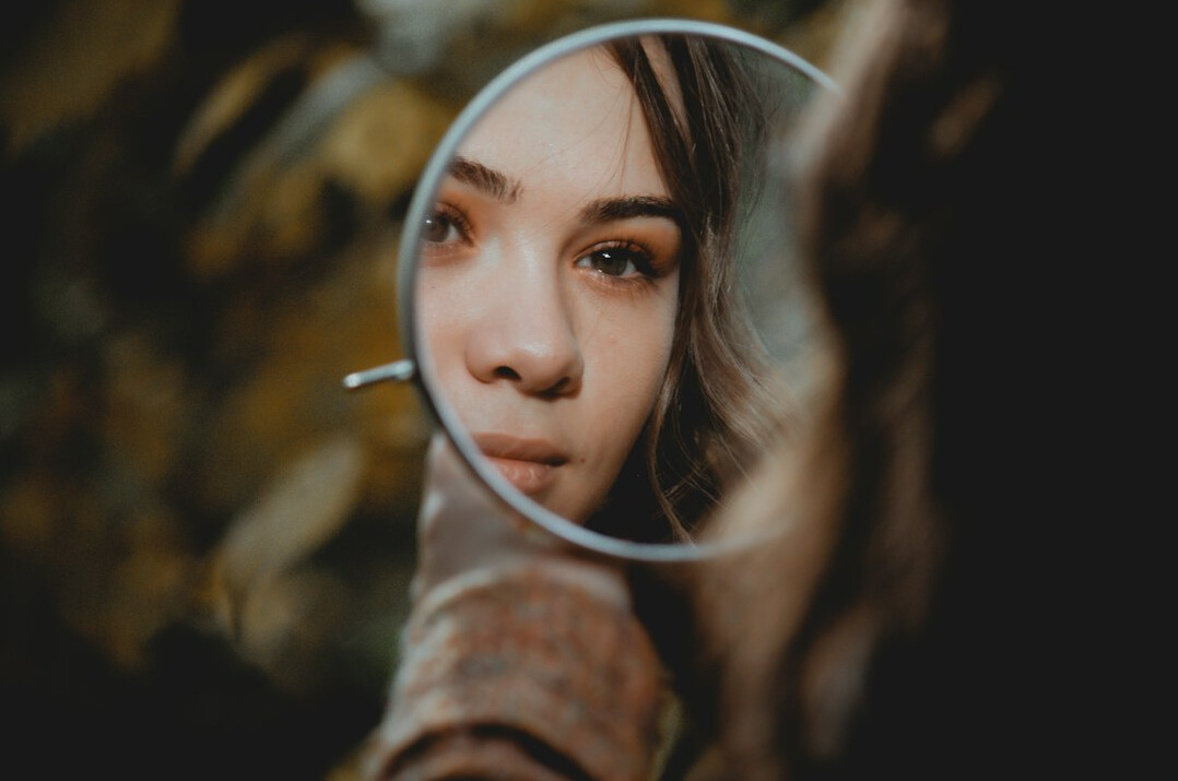 person looking in mirror