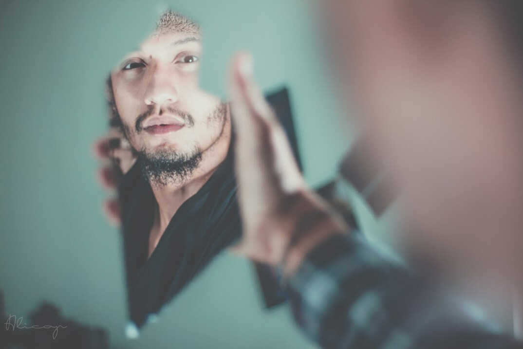 person looking in mirror