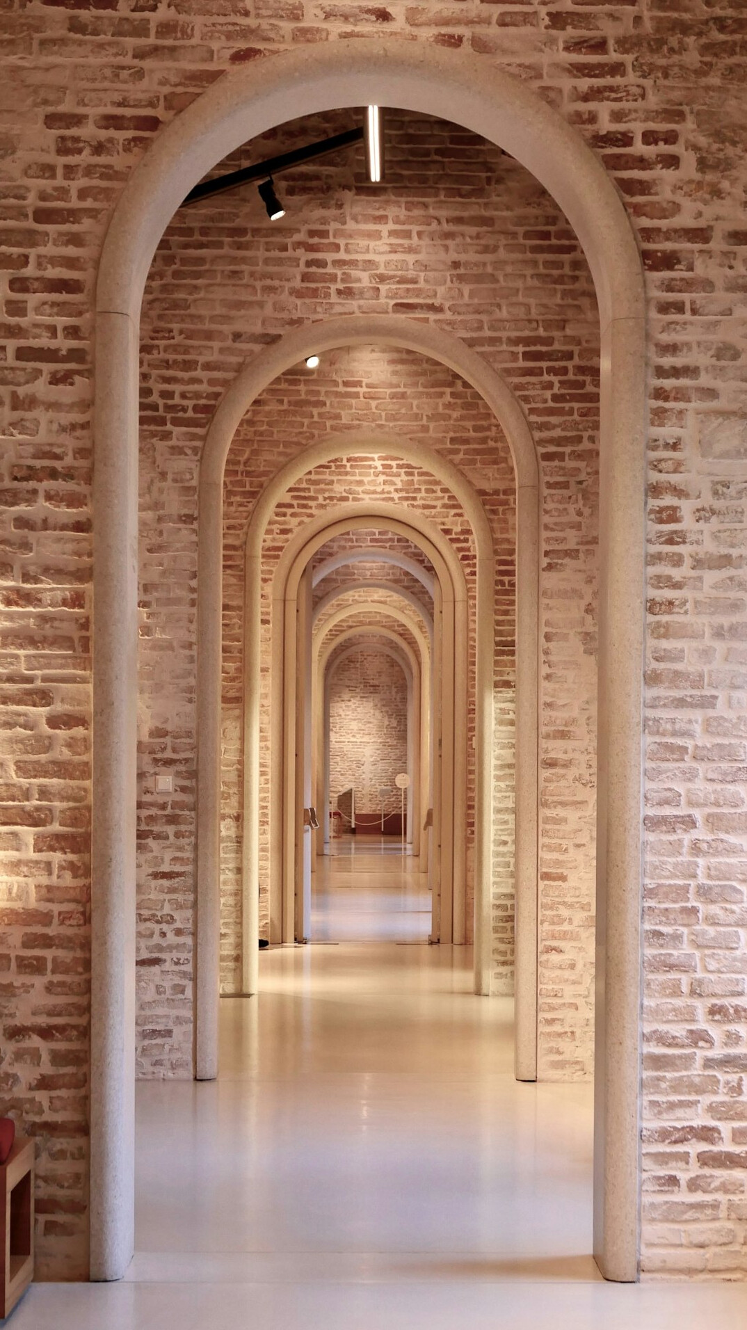 Minimalist museum gallery corridor with soft natural light